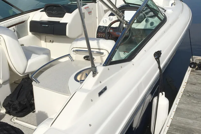 Slide: The Image of 2008 Sea Ray 270 SLX boat interior with steering wheel and seating. - 5