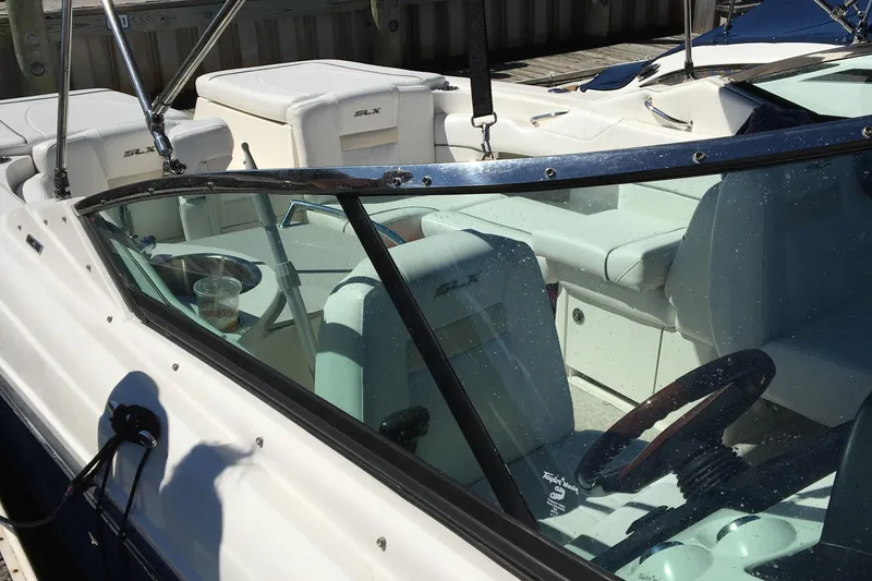 Slide: The Image of 2008 Sea Ray 270 SLX boat interior with seating and steering wheel. - 6