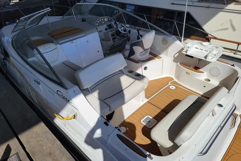 Slide: The Image of 2001 Bayliner 2655 Ciera boat interior with seating and steering wheel. - 2