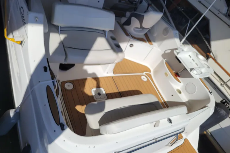 Slide: The Image of 2001 Bayliner 2655 Ciera boat interior with seating and wood-style flooring. - 4