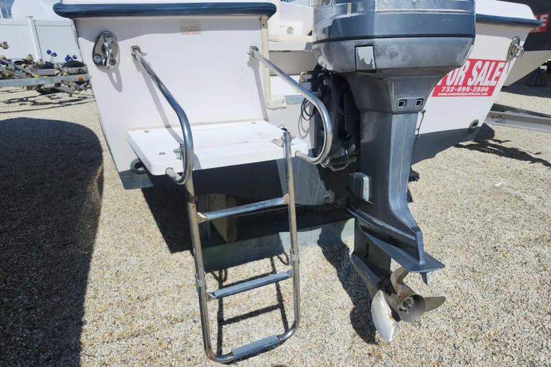 Slide: The Image of 2000 Grady-White Adventure 208 boat with outboard motor and ladder for sale. - 13