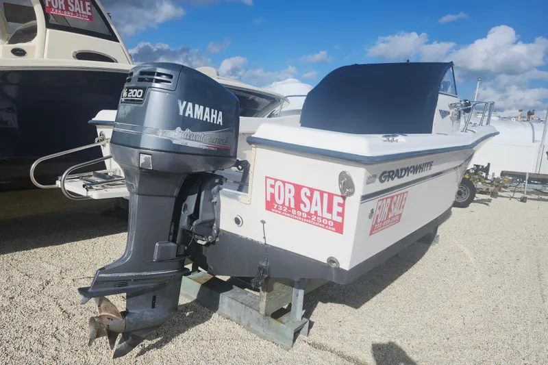 Slide: The Image of 2000 Grady-White Adventure 208 boat for sale with Yamaha engine, displayed outdoors. - 14