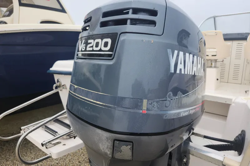 Slide: The Image of Yamaha V6 200 outboard motor on a 2000 Grady-White Adventure 208 boat. - 15