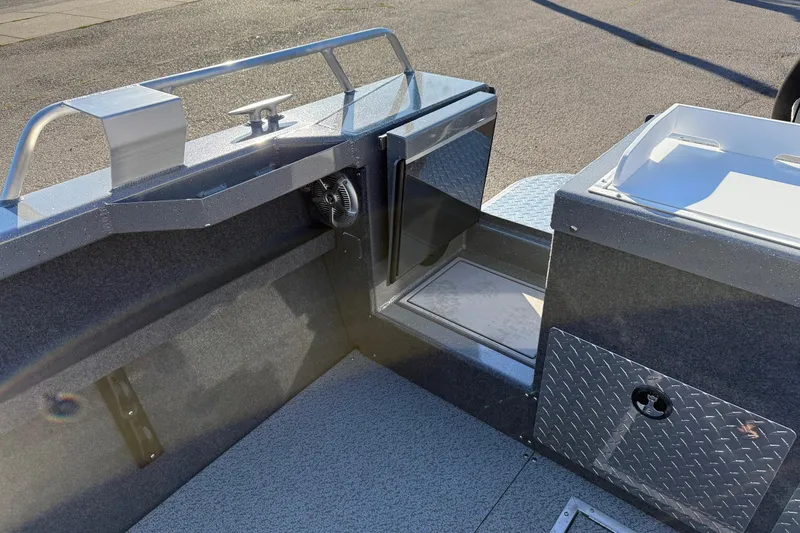 Slide: The Image of 2026 Thunder Jet 200 Luxor boat interior with storage compartments and sleek design. - 13