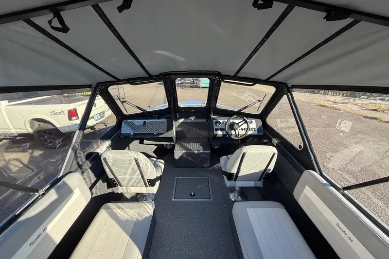 Slide: The Image of Interior view of 2026 Thunder Jet 200 Luxor boat with seating and steering console. - 17