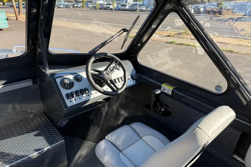 Slide: The Image of Interior of 2026 Thunder Jet 200 Luxor boat with steering wheel and dashboard controls. - 21