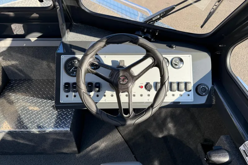 Slide: The Image of 2026 Thunder Jet 200 Luxor boat dashboard with steering wheel and control panel. - 23