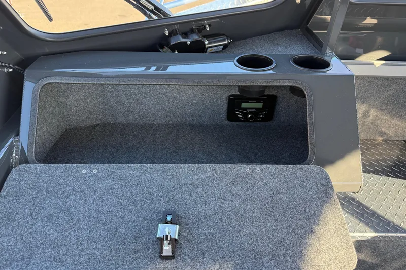 Slide: The Image of Interior of 2026 Thunder Jet 200 Luxor boat with storage and cup holders. - 26