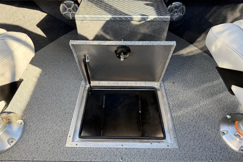 Slide: The Image of 2026 Thunder Jet 200 Luxor boat interior with open storage compartment and seating. - 29