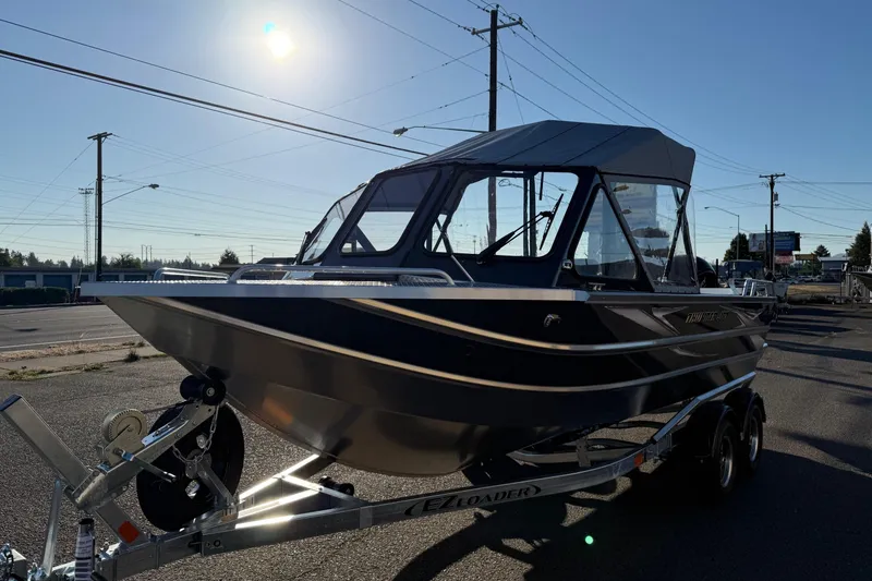 Slide: The Image of 2026 Thunder Jet 200 Luxor boat on trailer under bright sun. - 5
