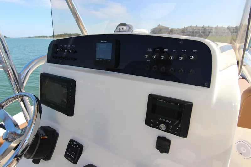 Slide: The Image of Control panel of 2022 Pioneer 220 Bay Sport boat with navigation and audio systems. - 19