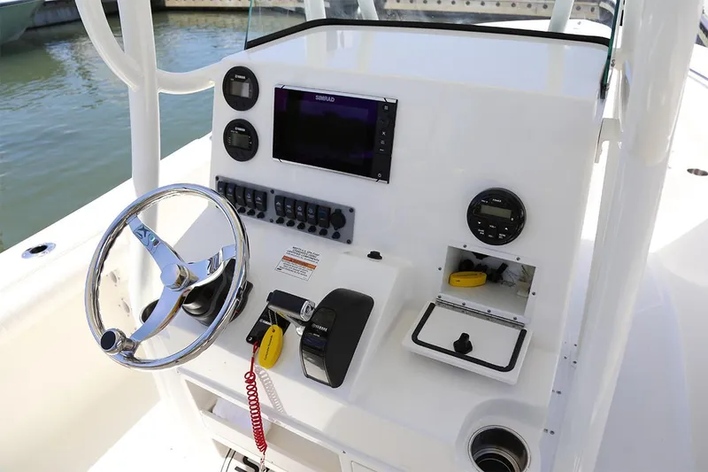 Slide: The Image of 2026 Sea Born LX24 Center Console boat seats with gray diamond-stitched upholstery. - 11