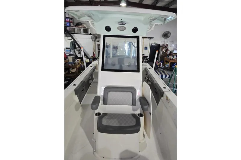 Slide: The Image of 2026 Sea Born LX24 Center Console boat interior with seating and control panel. - 18