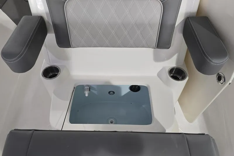 Slide: The Image of 2026 Sea Born LX24 Center Console boat seating with cup holders and storage compartment. - 19