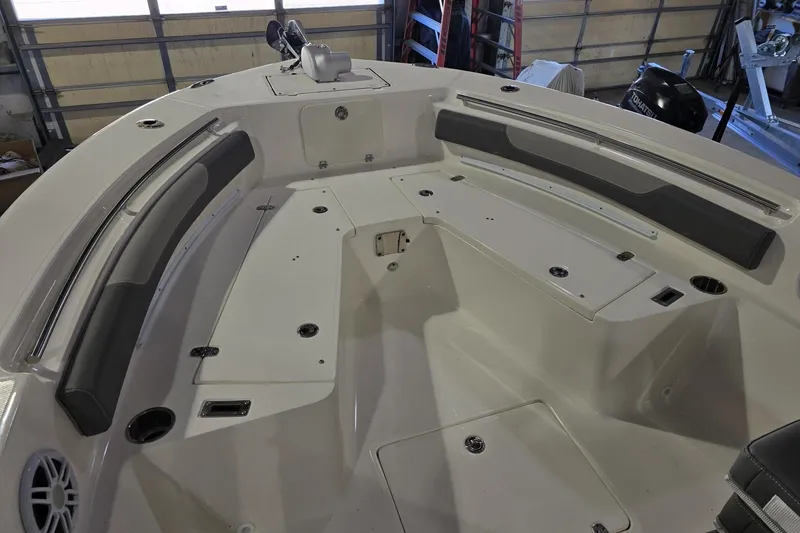 Slide: The Image of 2026 Sea Born LX24 Center Console boat interior with seating and storage compartments. - 21