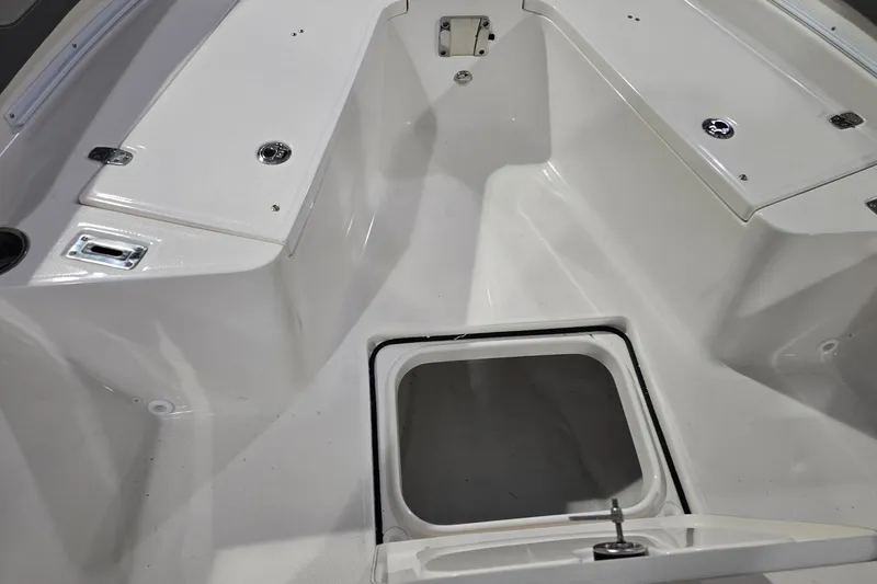 Slide: The Image of 2026 Sea Born LX24 Center Console boat interior with storage compartments. - 23