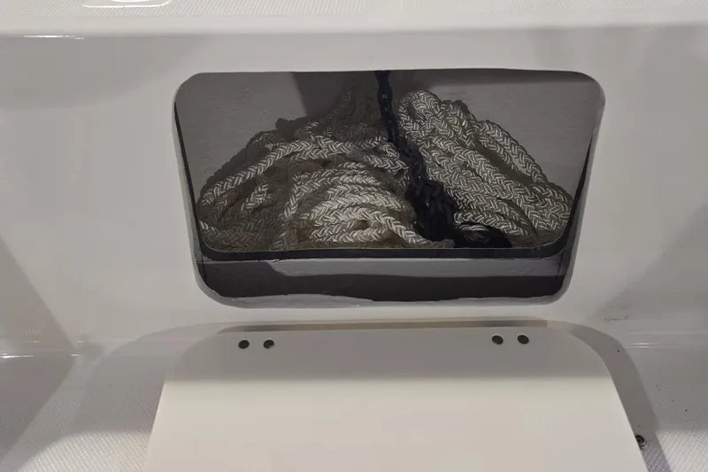 Slide: The Image of Anchor storage compartment on 2026 Sea Born LX24 Center Console boat. - 24
