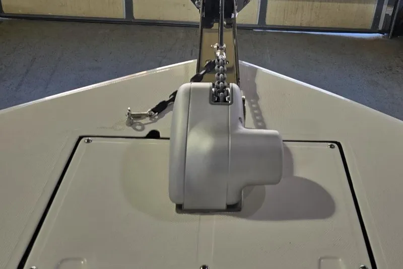 Slide: The Image of 2026 Sea Born LX24 Center Console boat anchor system in a garage setting. - 25