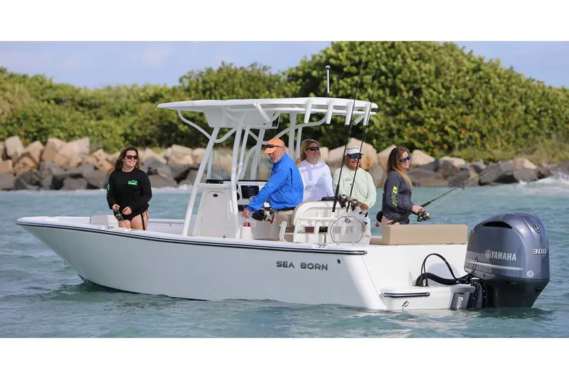 Slide: The Image of 2026 Sea Born LX24 Center Console boat livewell with logo on lid. - 5