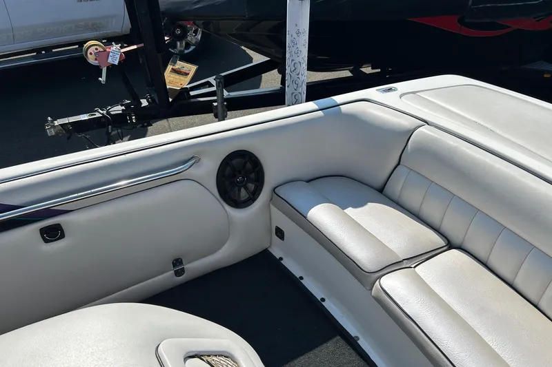 Slide: The Image of Interior of 1998 MB Boss 210 boat with white leather seating and speaker. - 11