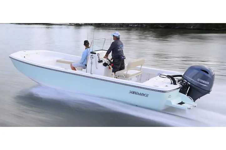 The Image of 2026 Sundance DX22 boat on trailer at Downeast Marine dealership. - 1