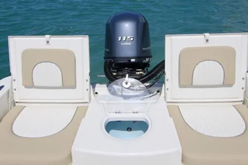 Slide: The Image of 2026 Sundance DX22 boat interior with storage compartments and seating area. - 14