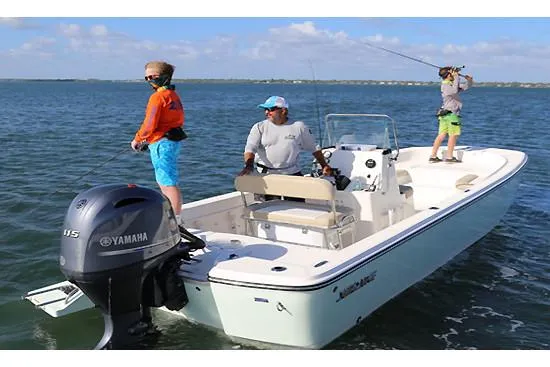 Slide: The Image of Sundance DX22 2026 boat interior with gray seating and storage compartments. - 4