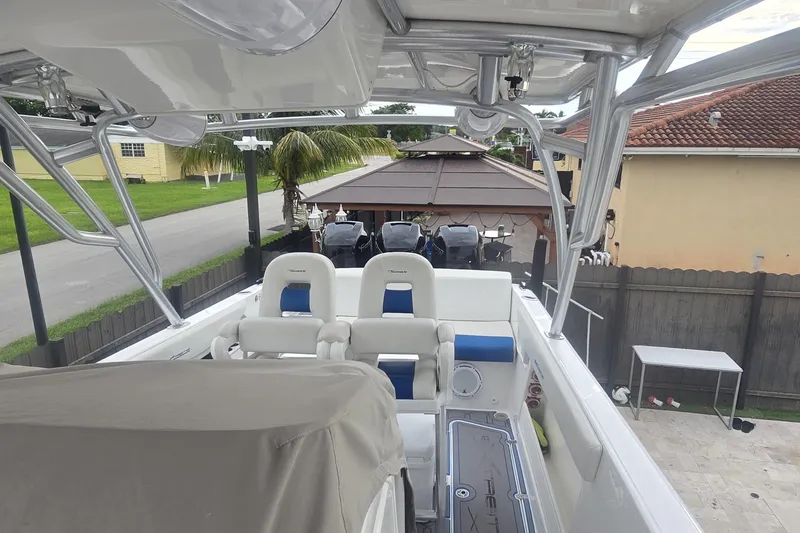 Slide: The Image of 2016 Extreme Boats 38 Cuddy Cabin on trailer under clear blue sky. - 12