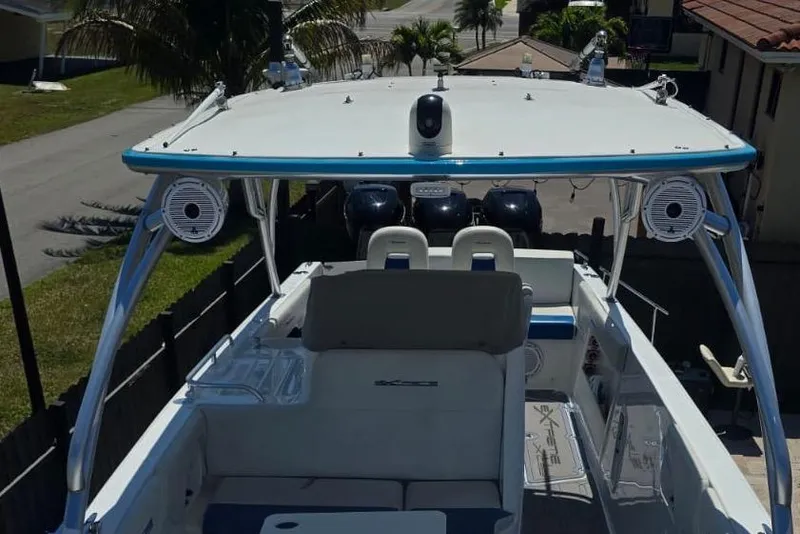 Slide: The Image of 2016 Extreme Boats 38 Cuddy Cabin dashboard with Garmin navigation system and controls. - 14