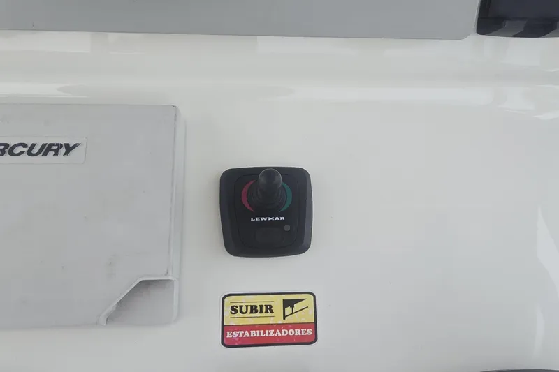 Slide: The Image of 2016 Extreme Boats 38 Cuddy Cabin helm with controls and navigation equipment. - 17