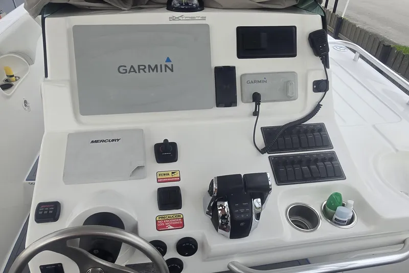 Slide: The Image of Control panel of a 2016 Extreme Boats 38 Cuddy Cabin with navigation equipment. - 18