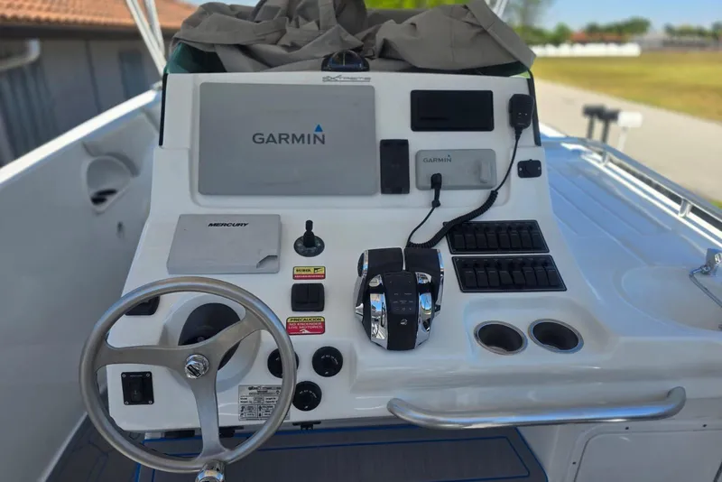 Slide: The Image of Control panel of a 2016 Extreme Boats 38 Cuddy Cabin with labeled switches. - 19
