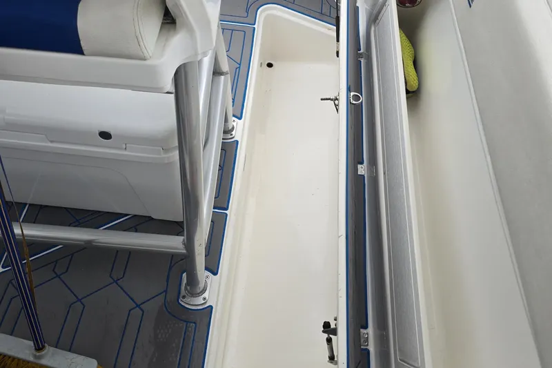 Slide: The Image of 2016 Extreme Boats 38 Cuddy Cabin interior with seating and table, under clear blue sky. - 30