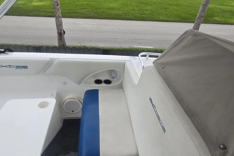 Slide: The Image of 2016 Extreme Boats 38 Cuddy Cabin interior storage compartment with open door. - 32
