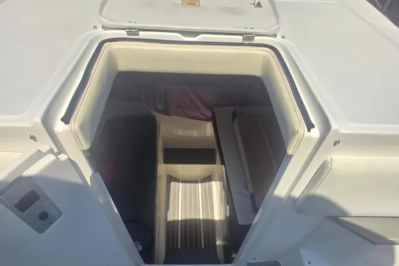 Slide: The Image of 2016 Extreme Boats 38 Cuddy Cabin interior with microwave and mini fridge. - 39