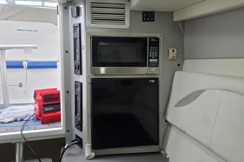 Slide: The Image of Interior of 2016 Extreme Boats 38 Cuddy Cabin with vent and microwave. - 40