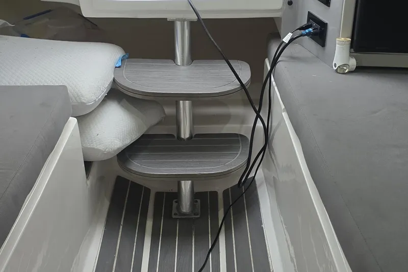 Slide: The Image of Interior view of a 2016 Extreme Boats 38 Cuddy Cabin, showcasing sleek design and storage space. - 42