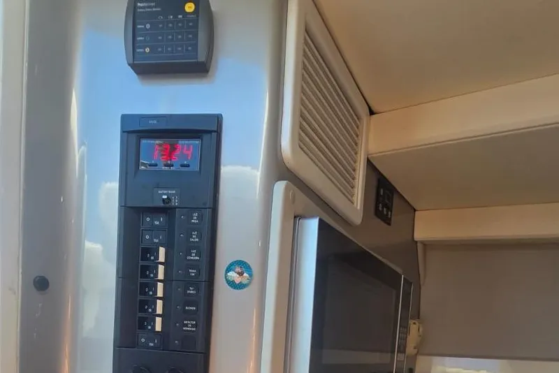 Slide: The Image of Battery status monitor on 2016 Extreme Boats 38 Cuddy Cabin dashboard. - 45