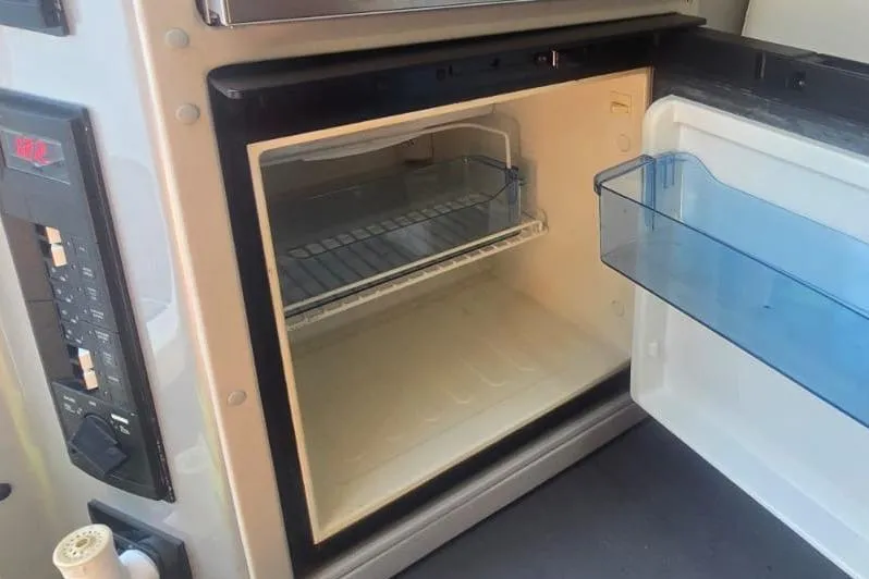 Slide: The Image of Interior of 2016 Extreme Boats 38 Cuddy Cabin, featuring sleek design and comfortable seating. - 47