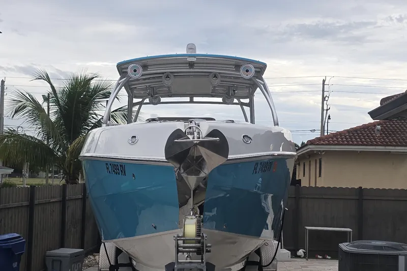 Slide: The Image of 2016 Extreme Boats 38 Cuddy Cabin interior with seating and outboard motors. - 6