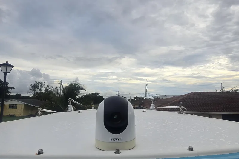 Slide: The Image of Storage area on 2016 Extreme Boats 38 Cuddy Cabin with black bags and branded flooring. - 65