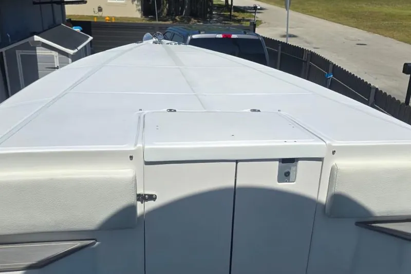 Slide: The Image of 2016 Extreme Boats 38 Cuddy Cabin interior storage compartment with safety gear. - 67