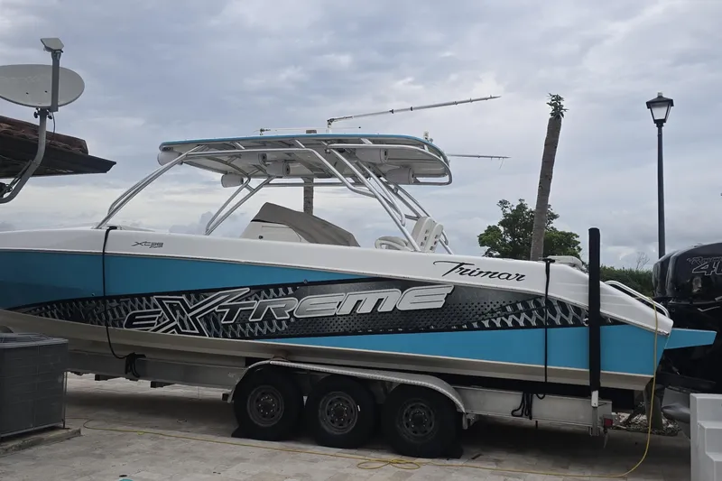 Slide: The Image of Control panel with red switches on a 2016 Extreme Boats 38 Cuddy Cabin. - 68