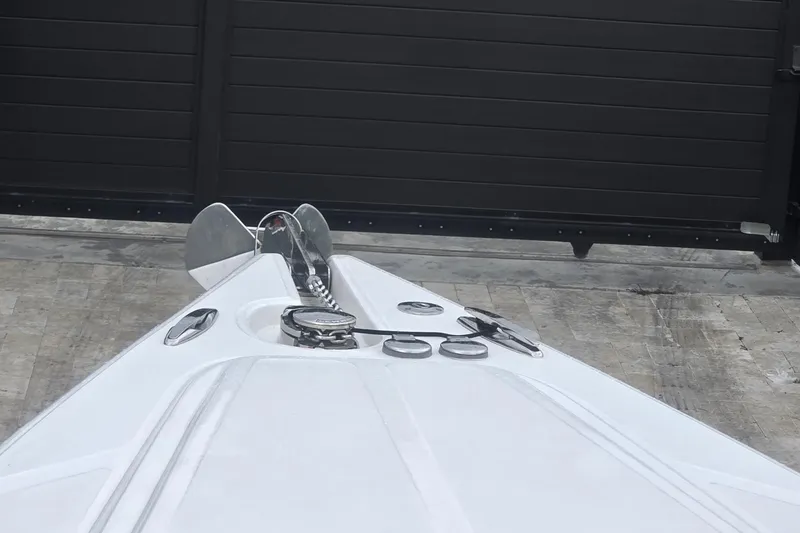 Slide: The Image of 2016 Extreme Boats 38 Cuddy Cabin with triple outboard engines, parked on grass. - 71