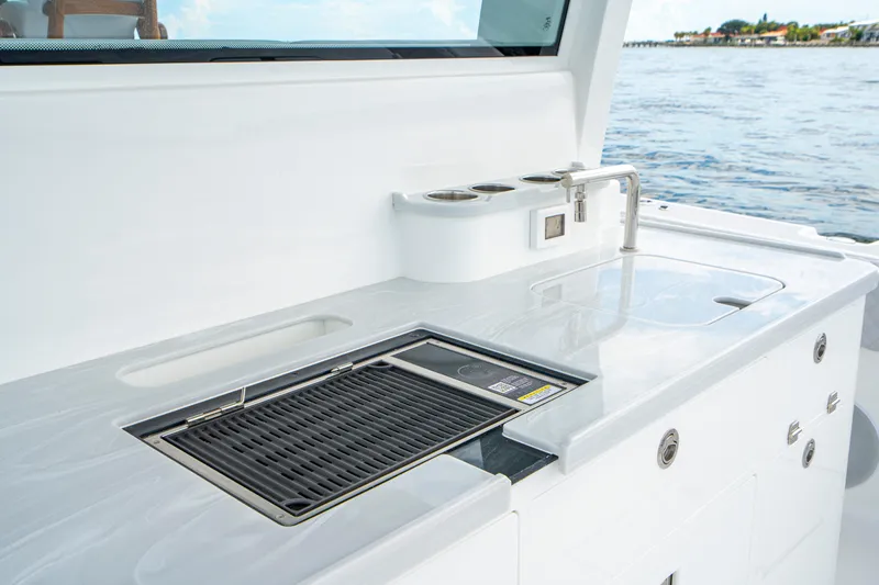 Slide: The Image of Outdoor kitchen on 2026 HCB 56 Suenos GIX yacht with grill and sink by the sea. - 17