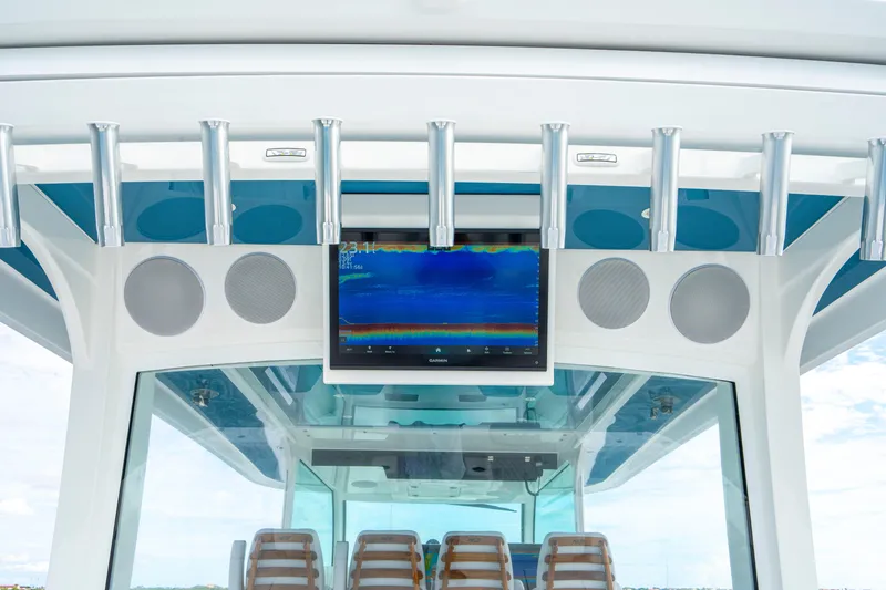 Slide: The Image of 2026 HCB 56 Suenos GIX boat interior with advanced navigation display and speakers. - 19