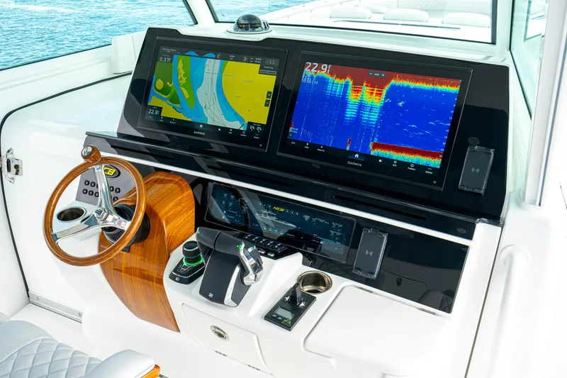 Slide: The Image of Helm of 2026 HCB 56 Suenos GIX with advanced navigation displays and controls. - 28