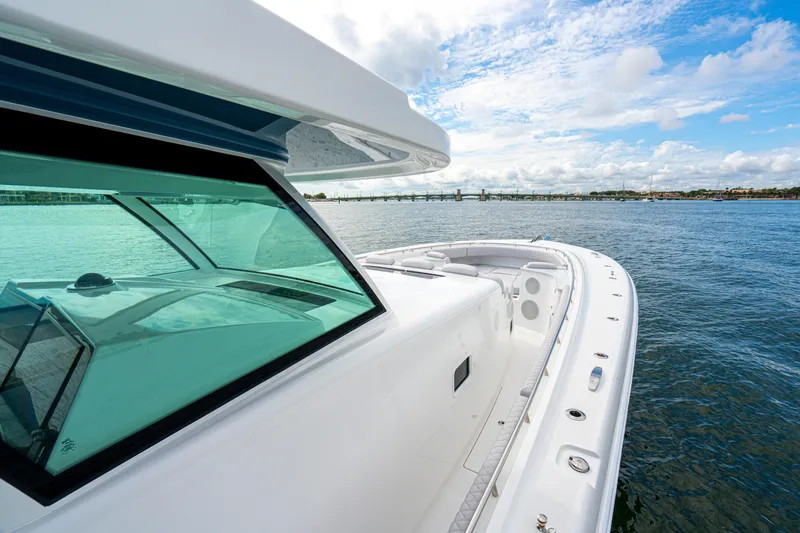 Slide: The Image of 2026 HCB 56 Suenos GIX luxury yacht on open water, showcasing sleek design. - 33