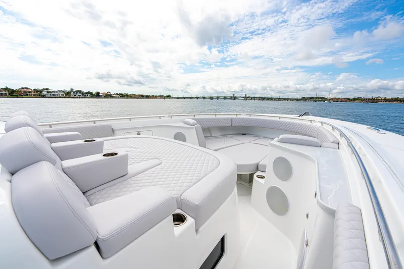 Slide: The Image of Luxurious 2026 HCB 56 Suenos GIX yacht interior with plush seating, overlooking serene waters. - 35