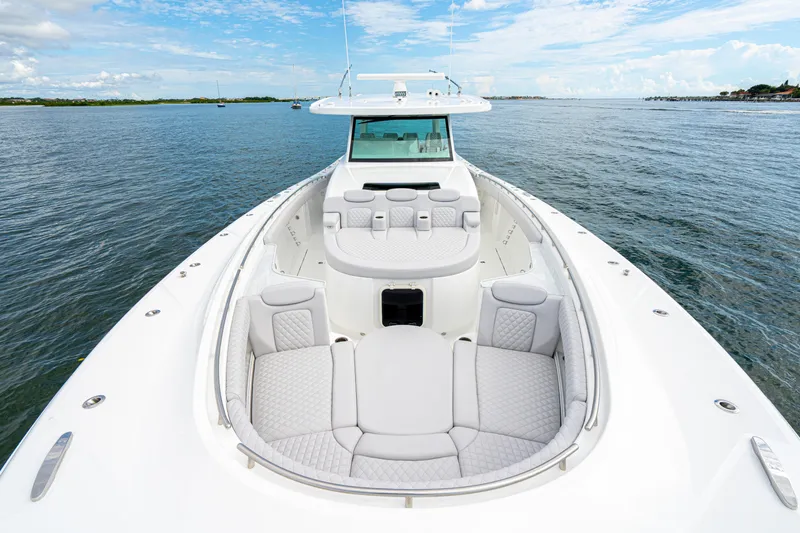 Slide: The Image of Luxurious 2026 HCB 56 Suenos GIX yacht with spacious seating on open water. - 40